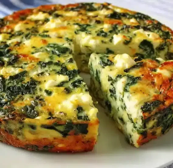Cottage Cheese and Spinach Crustless Quiche - 5 Star Recipe 4 Slice of cottage cheese and spinach crustless quiche served on a plate.